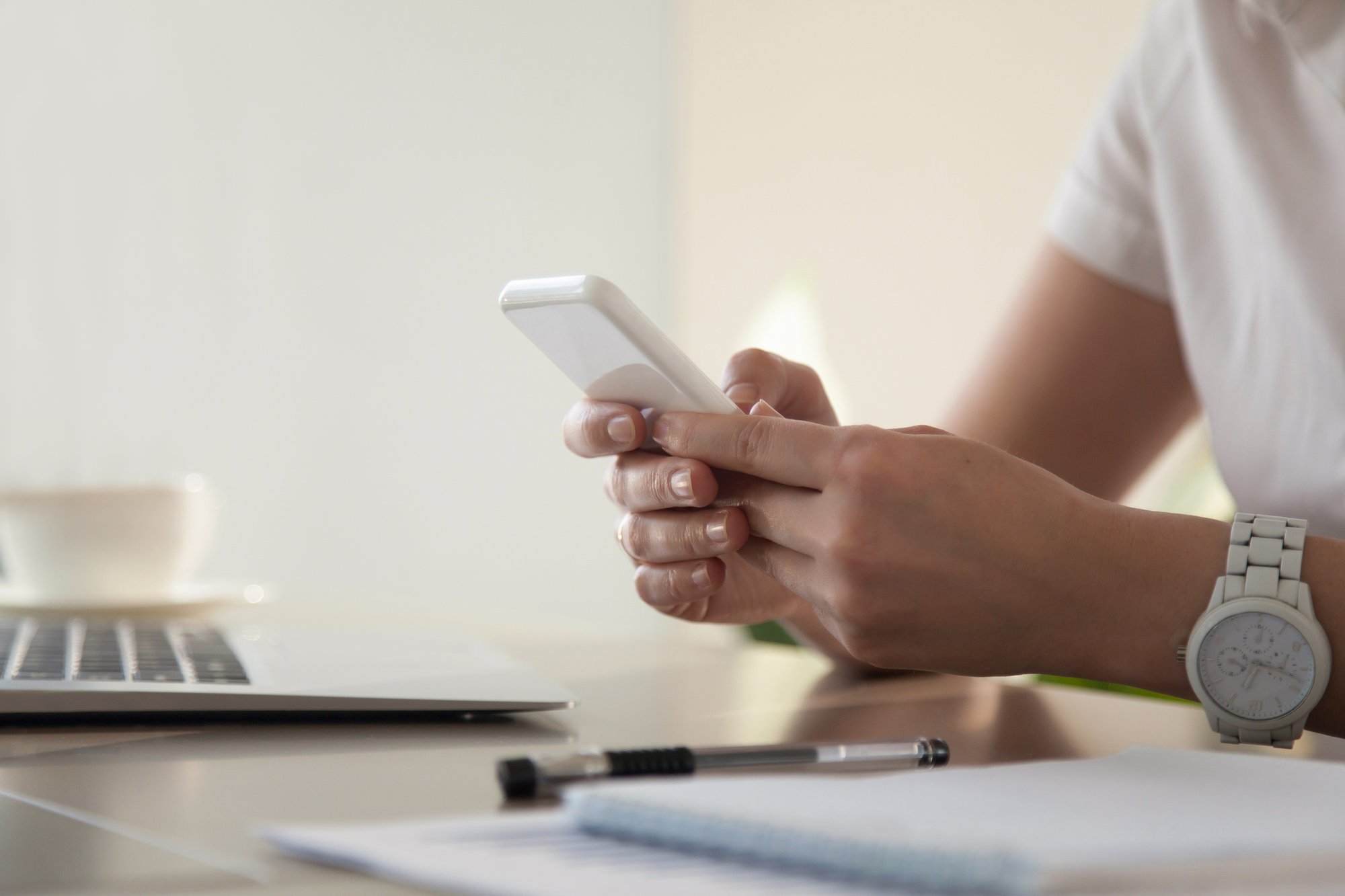 businesswoman-looking-important-contact-phone