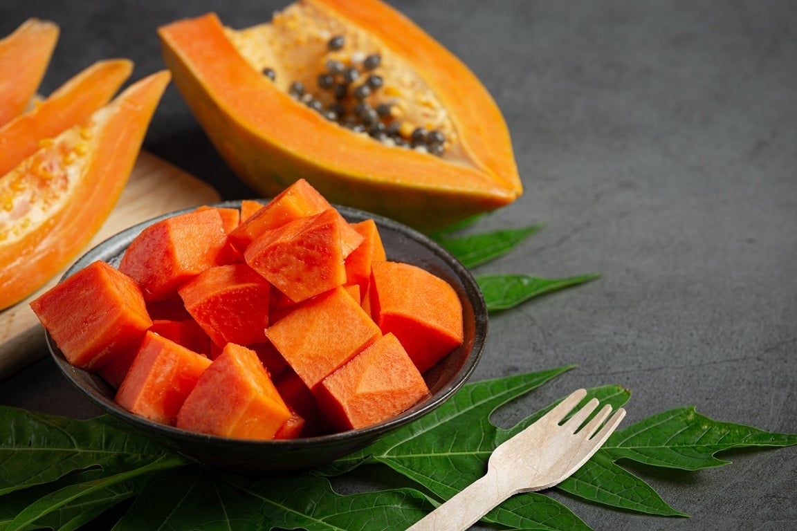 fresh-papaya-cut-into-pieces-put-black-plate