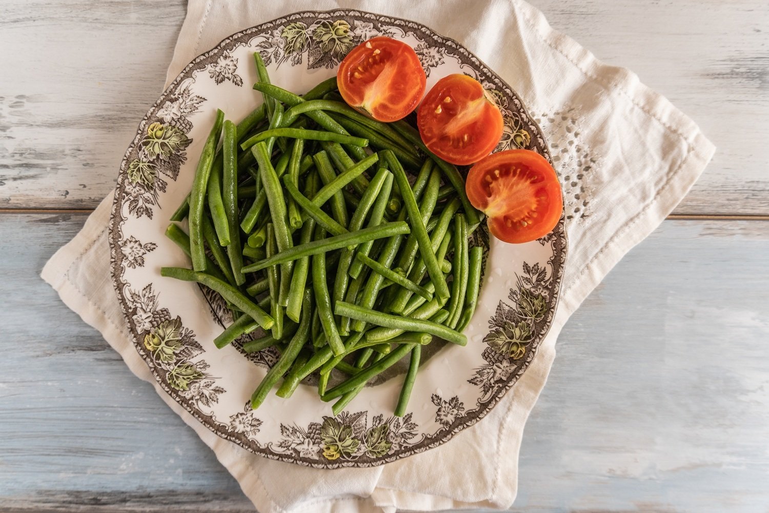 overhead-shot-fresh-green-beans-sliced-tomatoes-plate